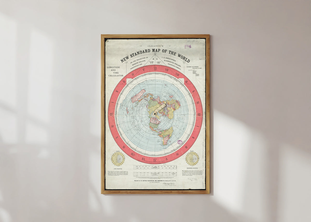 Framed art print of Gleason's New Standard Map of the World by Alexander Gleason, in a light wood frame on a sunlit white wall