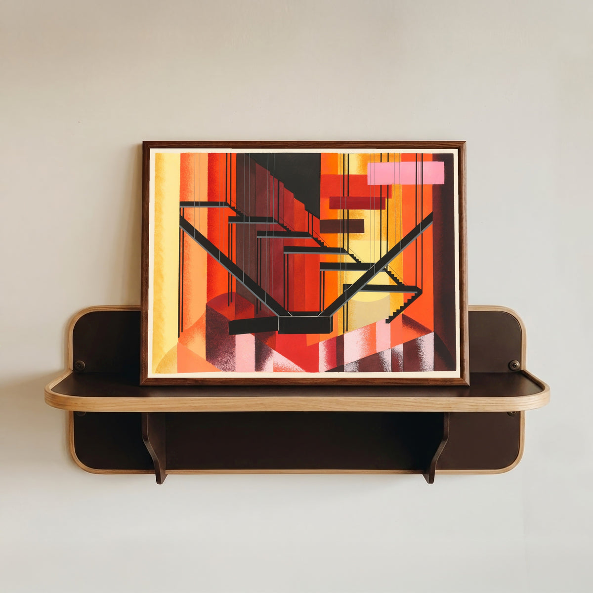 Framed art print of Maquettes de Théâtre 13 by Alexandra Exter, in a dark wood frame resting on a wall shelf