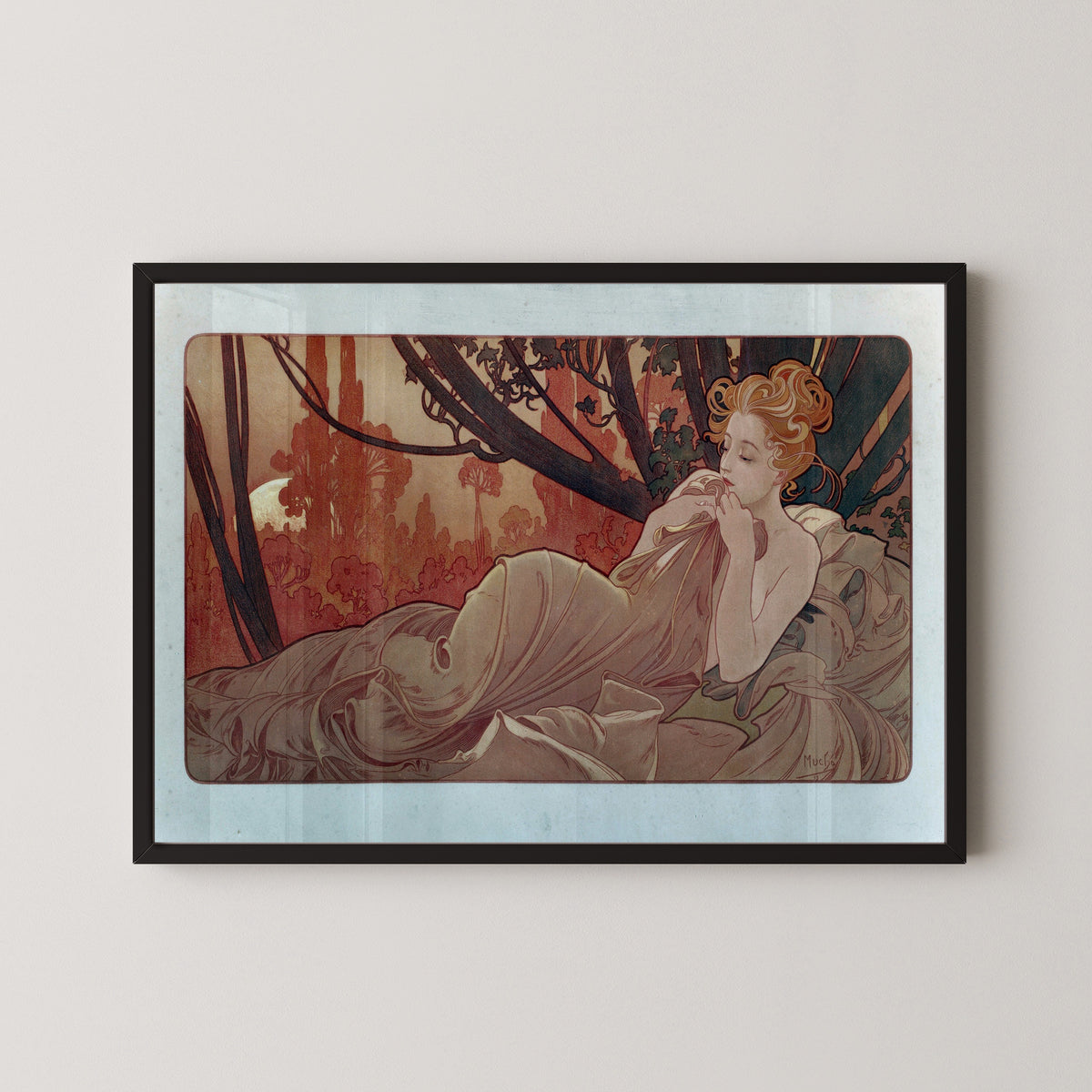 Framed art print of Dusk by Alphonse Mucha, in a black frame on a pale wall