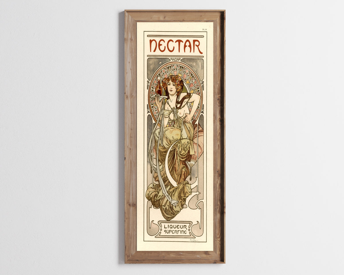 Framed art print of Nectar by Alphonse Mucha, in a tall wooden frame on a pale wall
