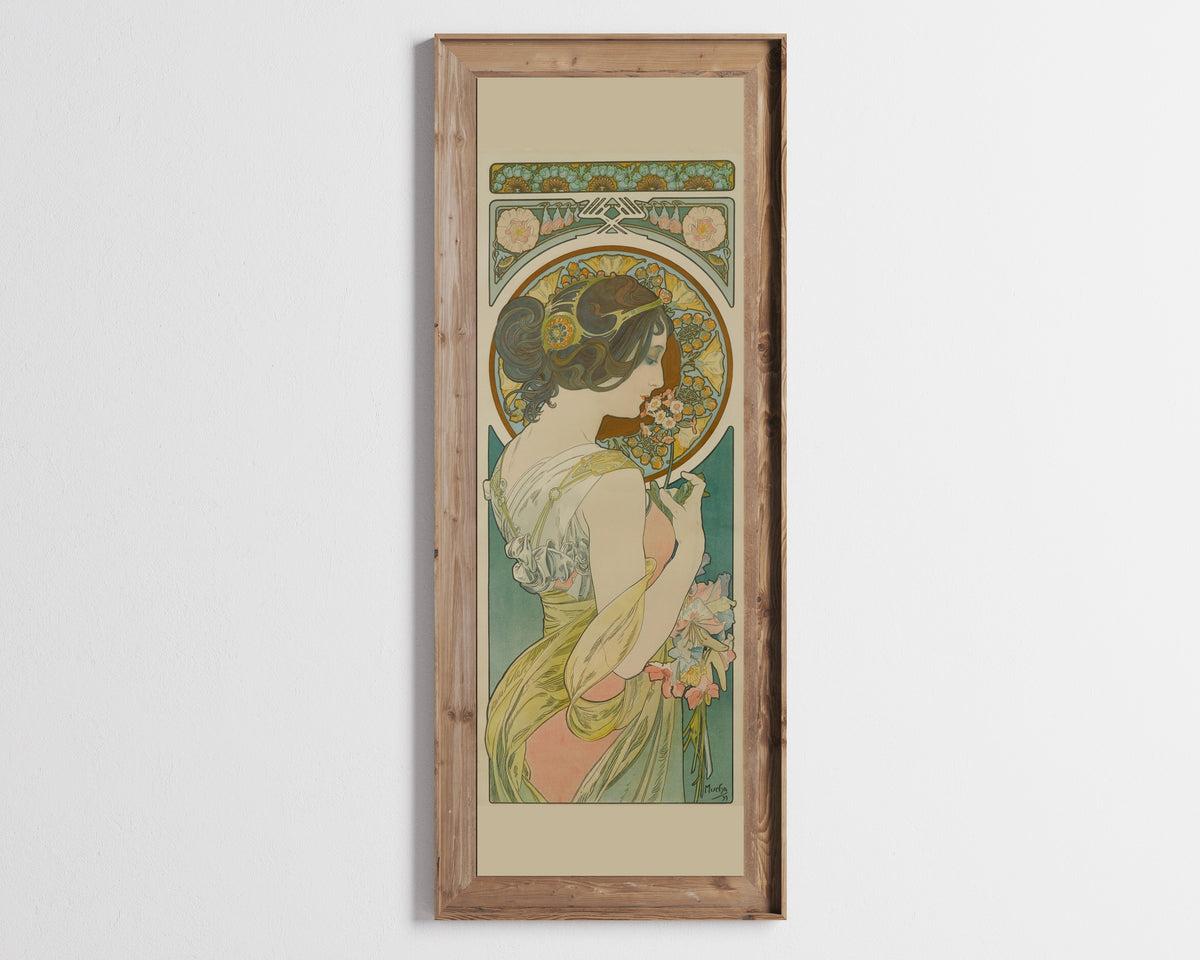 Primrose by Alphonse Mucha — in a tall wooden frame on a pale wall