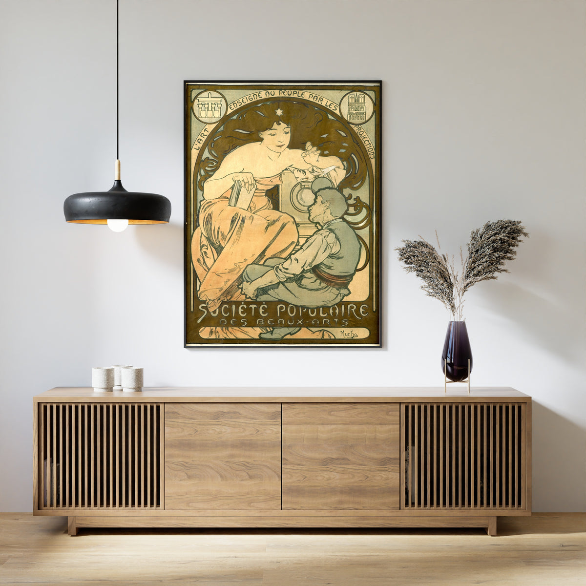 Framed art print of Société Populaire des Beaux-Arts by Alphonse Mucha, above a slatted wood sideboard
