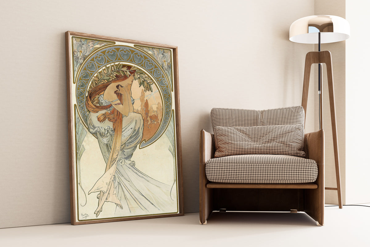 Framed art print of The Arts: Poetry by Alphonse Mucha, leaning against a wall beside an armchair and a floor lamp