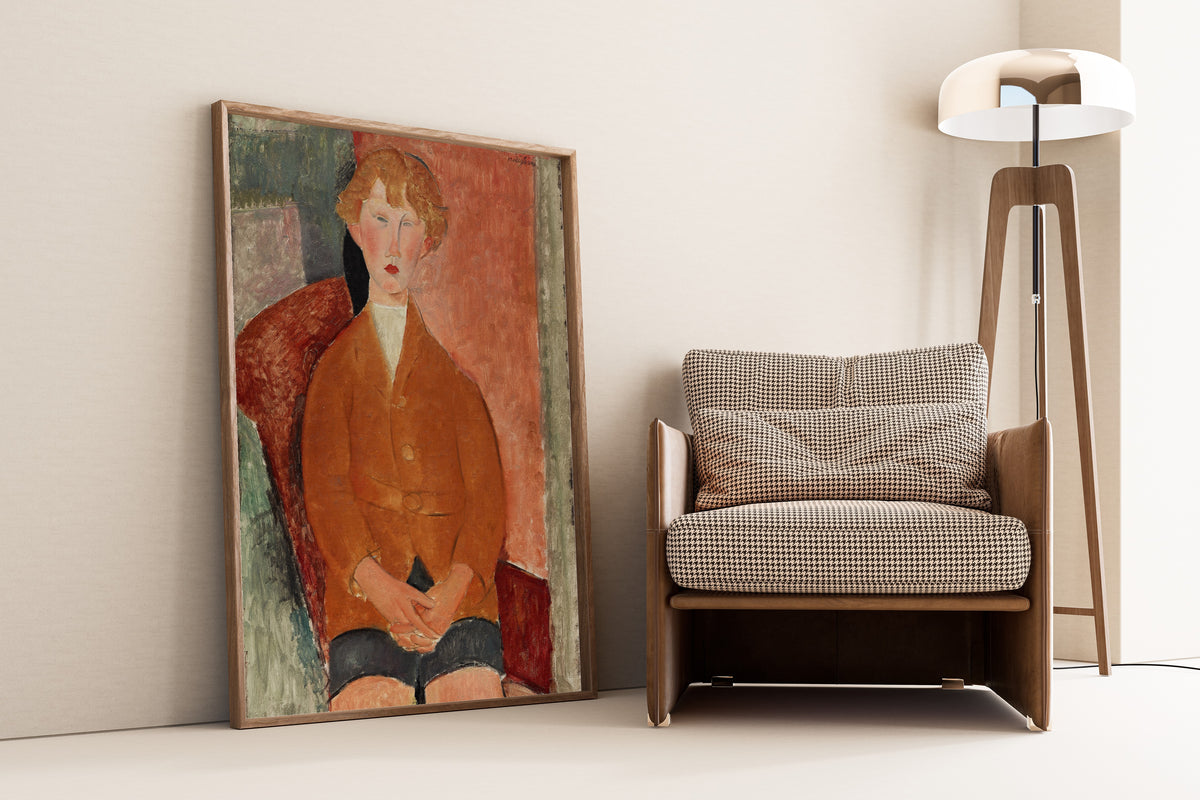 Boy in Short Pants by Amedeo Modigliani — framed and leaning against a wall beside an armchair and a floor lamp