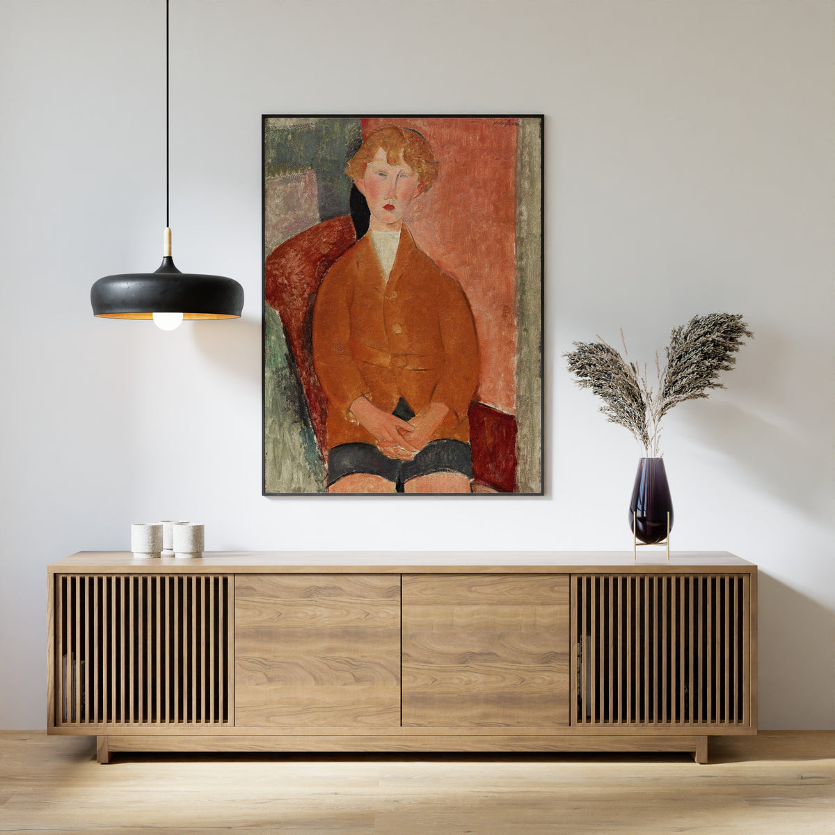 Boy in Short Pants by Amedeo Modigliani — framed above a slatted wood sideboard