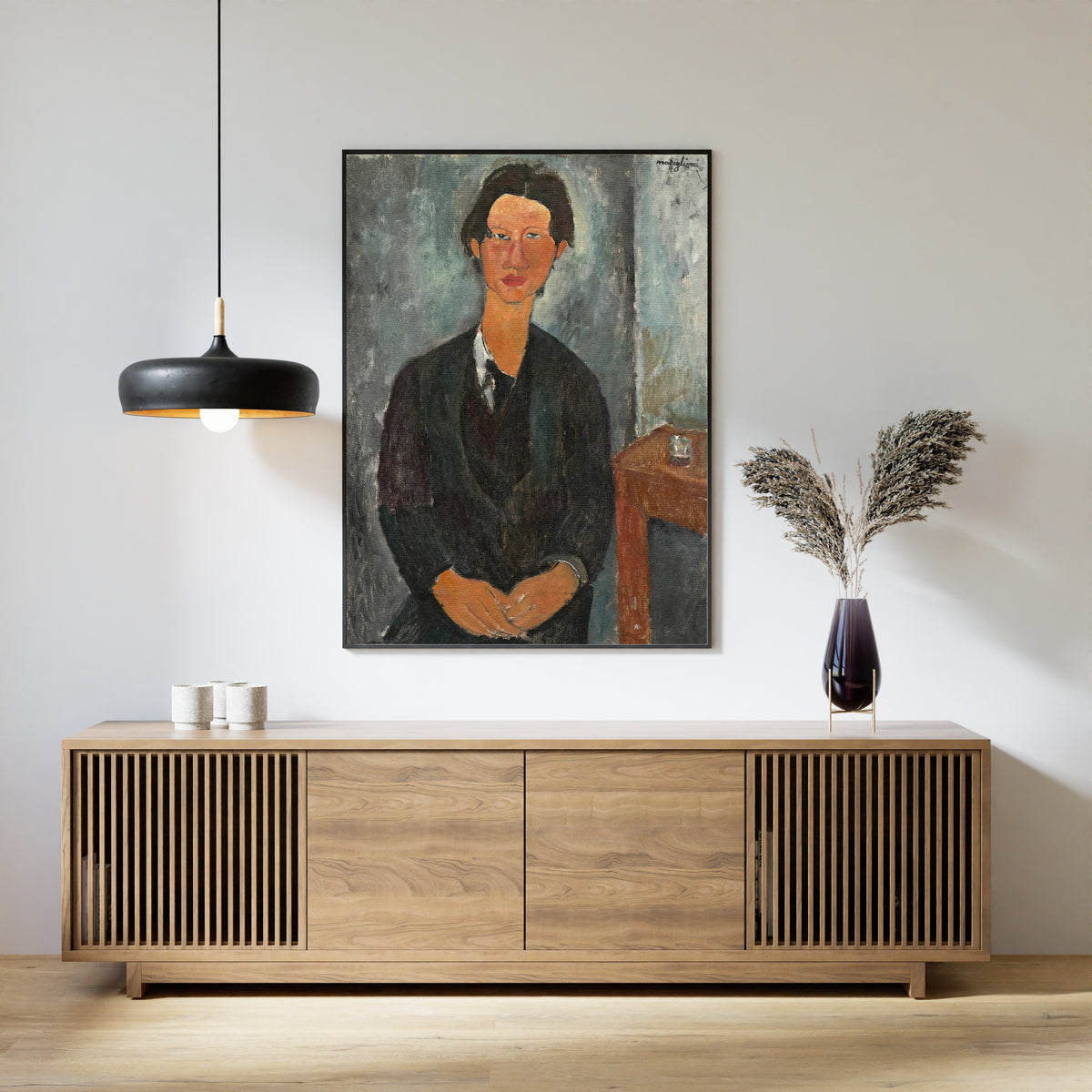 Chaim Soutine by Amedeo Modigliani — framed above a slatted wood sideboard