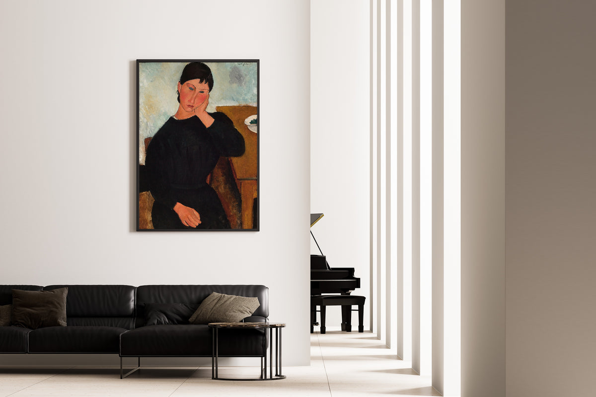 Elvira Resting at a Table by Amedeo Modigliani — framed on the wall of a minimal living room