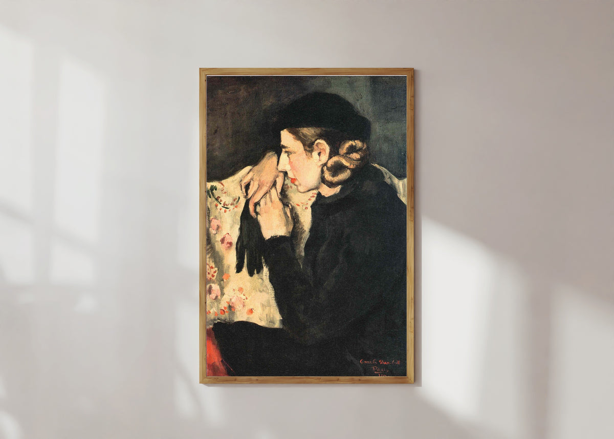 Framed art print of Denise Prouteaux (1932) by Amrita Sher-Gil, in a light wood frame on a sunlit white wall