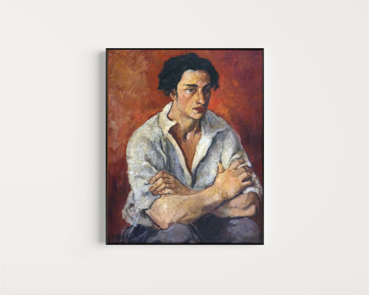 Framed art print of Portrait of a Young Man (1930) by Amrita Sher-Gil, in a slim black frame on a plain white wall