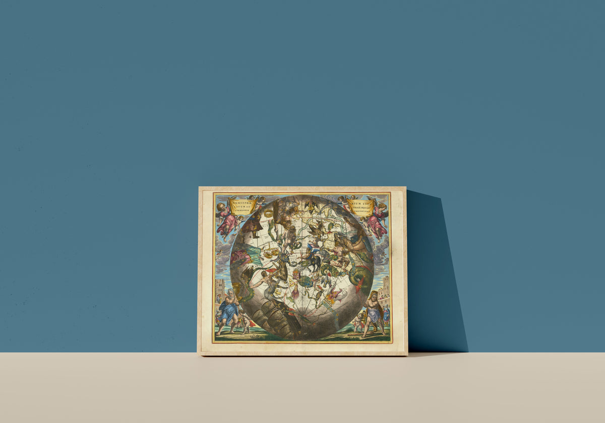 Framed art print of The Southern Starry Hemisphere in Equal Proportion (Plate 29) by Andreas Cellarius, in a light wood frame leaning on a blue wall