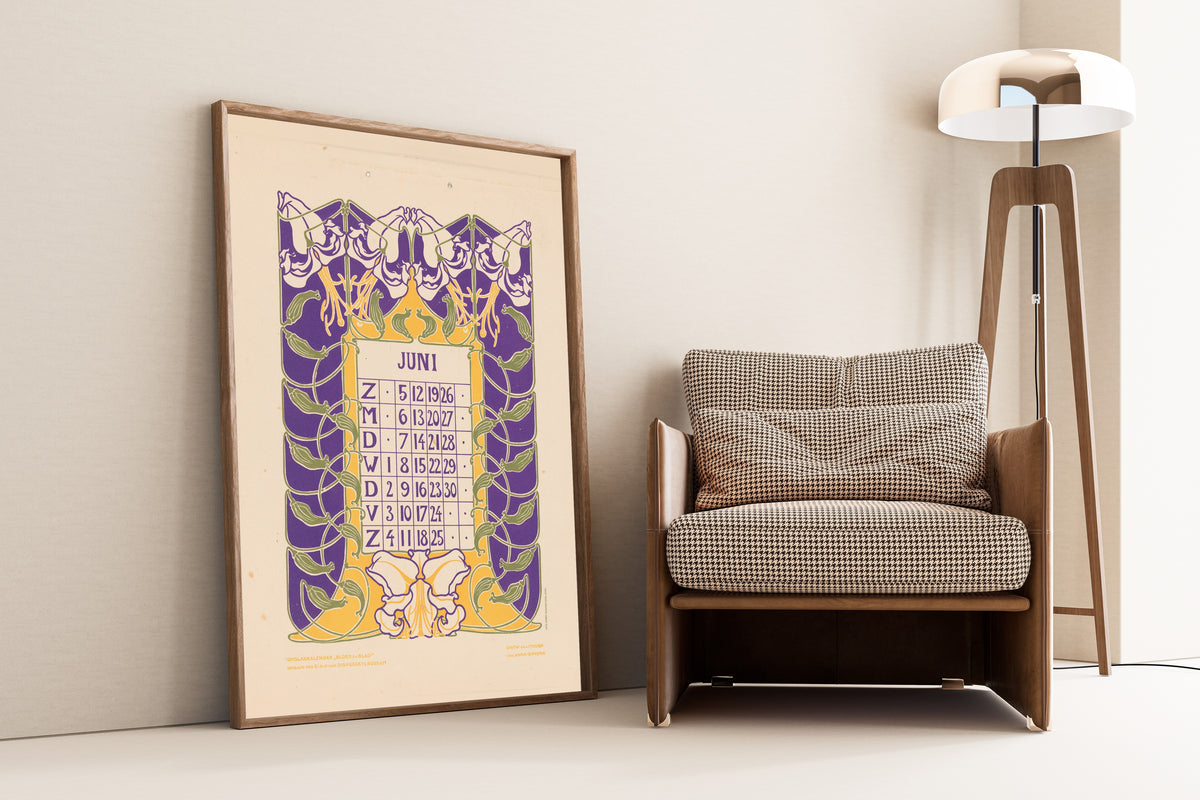 Kalenderblad juni met orchideeën [Calendar sheet June with orchids] by Anna Sipkema — framed and leaning against a wall beside an armchair and a floor lamp