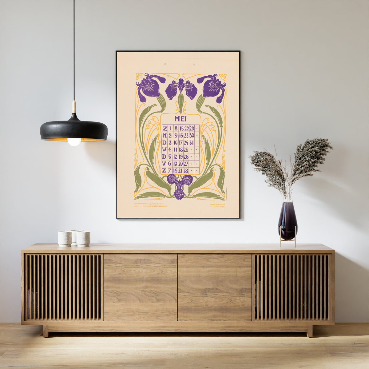 Kalenderblad mei met irissen [Calendar sheet May with irises] by Anna Sipkema — framed above a slatted wood sideboard