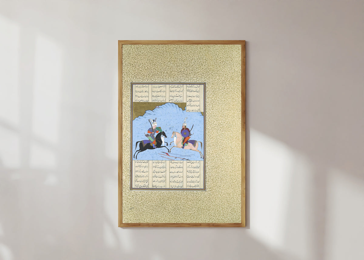 Framed art print of Shahnama of Shah Tahmasp: Rustam and Isfandiyar Begin Their Combat by Aqa Mirak (attributed), in a light wood frame on a sunlit white wall