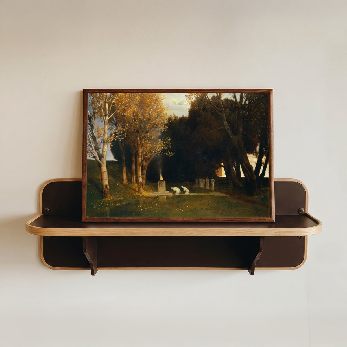 Framed art print of The Sacred Grove by Arnold Böcklin, in a dark wood frame resting on a wall shelf