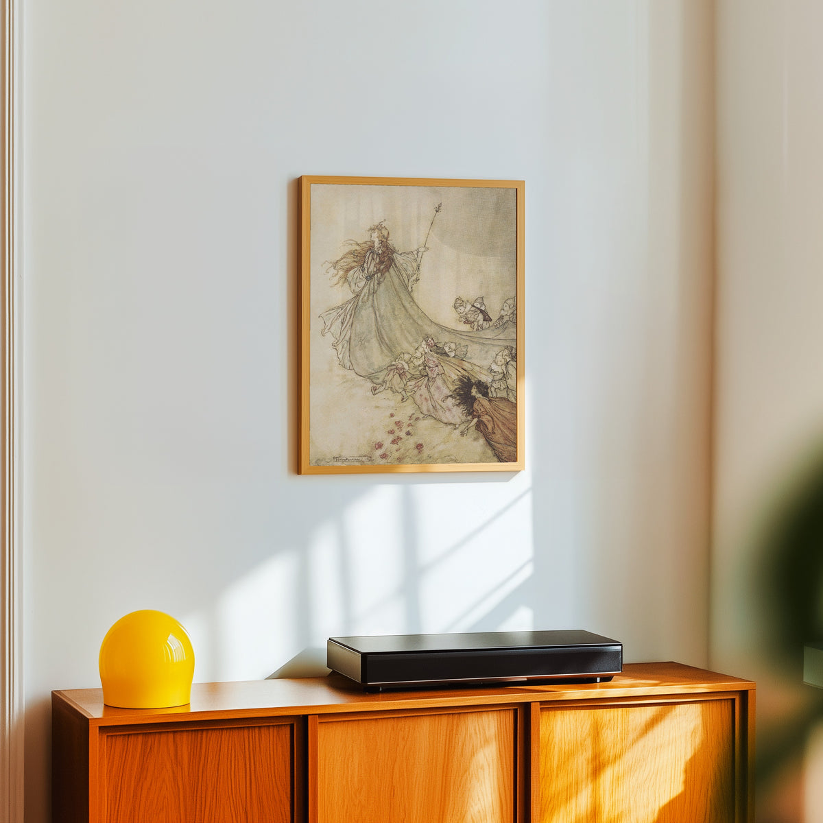 Framed art print of Fairies, Away! We Shall Chide Downright If I Longer Stay by Arthur Rackham, in a light wood frame on a white wall above an orange sideboard