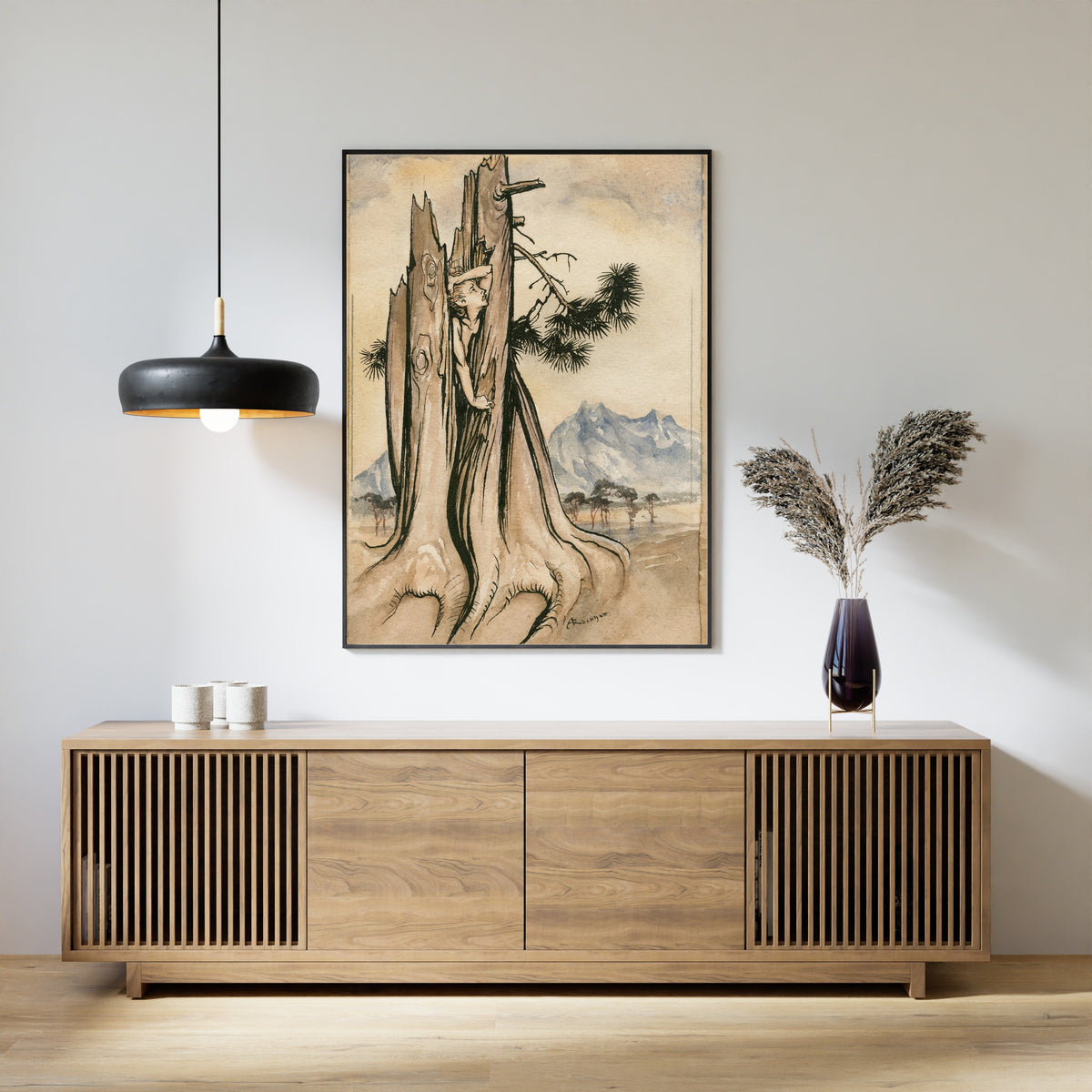 Framed art print of Imprisoned Ariel by Arthur Rackham, above a slatted wood sideboard