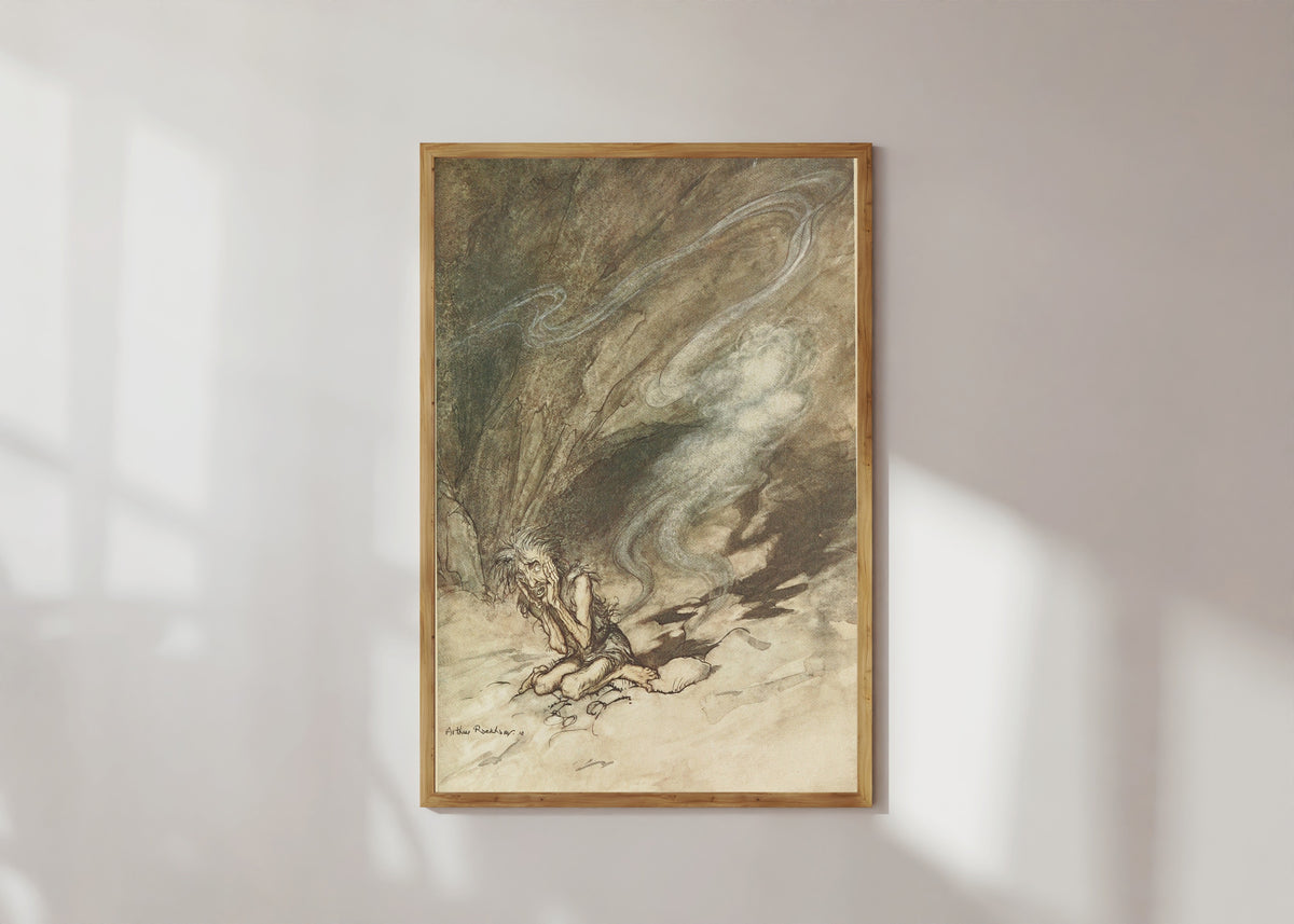 Framed art print of Mime Writhes Under the Lashes He Receives by Arthur Rackham, in a light wood frame on a sunlit white wall
