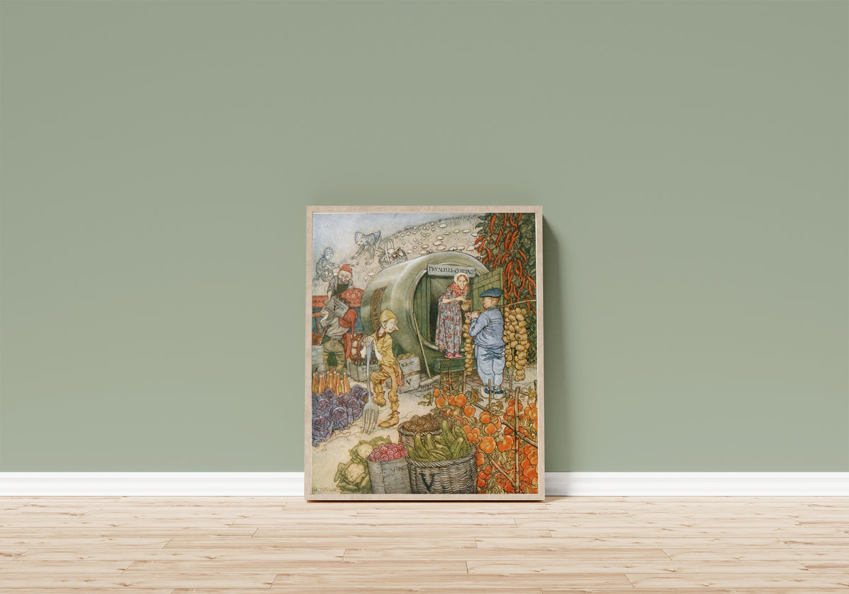 Framed art print of Mr. and Mrs. Vinegar at Home by Arthur Rackham, in a light wood frame leaning on a sage green wall above a wooden floor