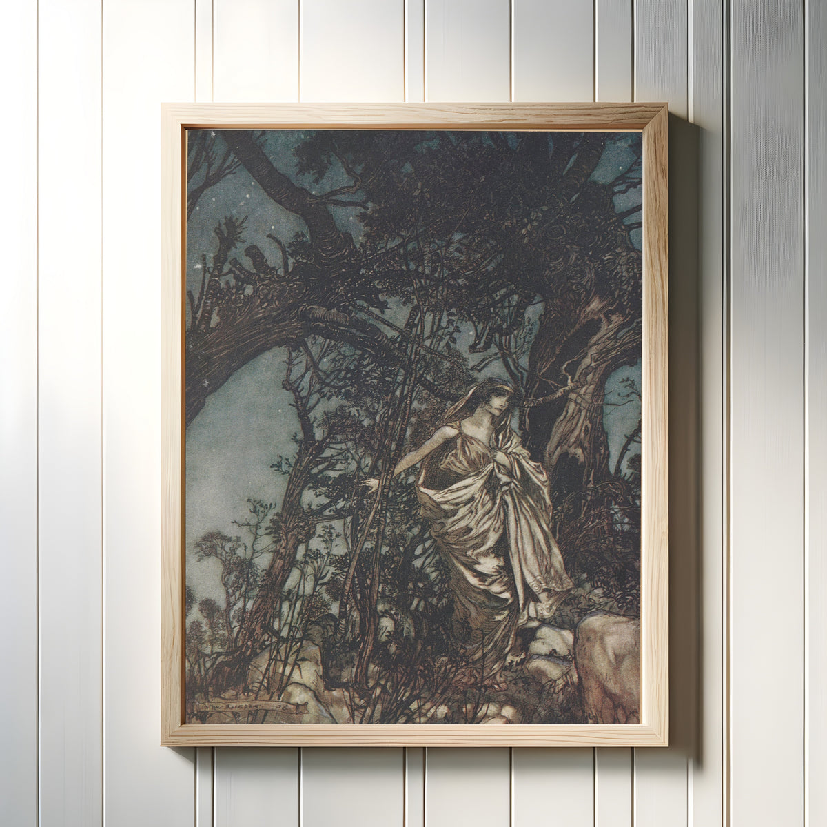 Framed art print of Never So Weary, Never So in Woe by Arthur Rackham, in a light wood frame on a white panelled wall