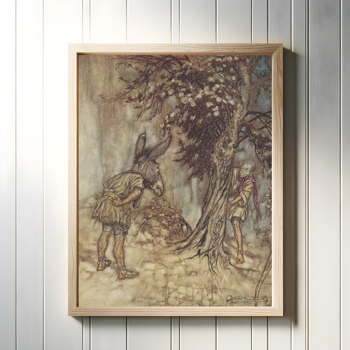 Framed art print of O Bottom, Thou Art Changed! by Arthur Rackham, in a light wood frame on a white panelled wall