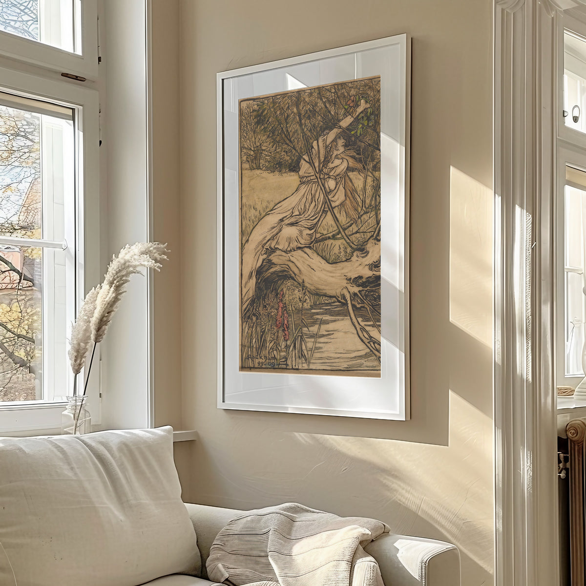 Framed art print of Ophelia by Arthur Rackham, in a sunlit living room above a sofa