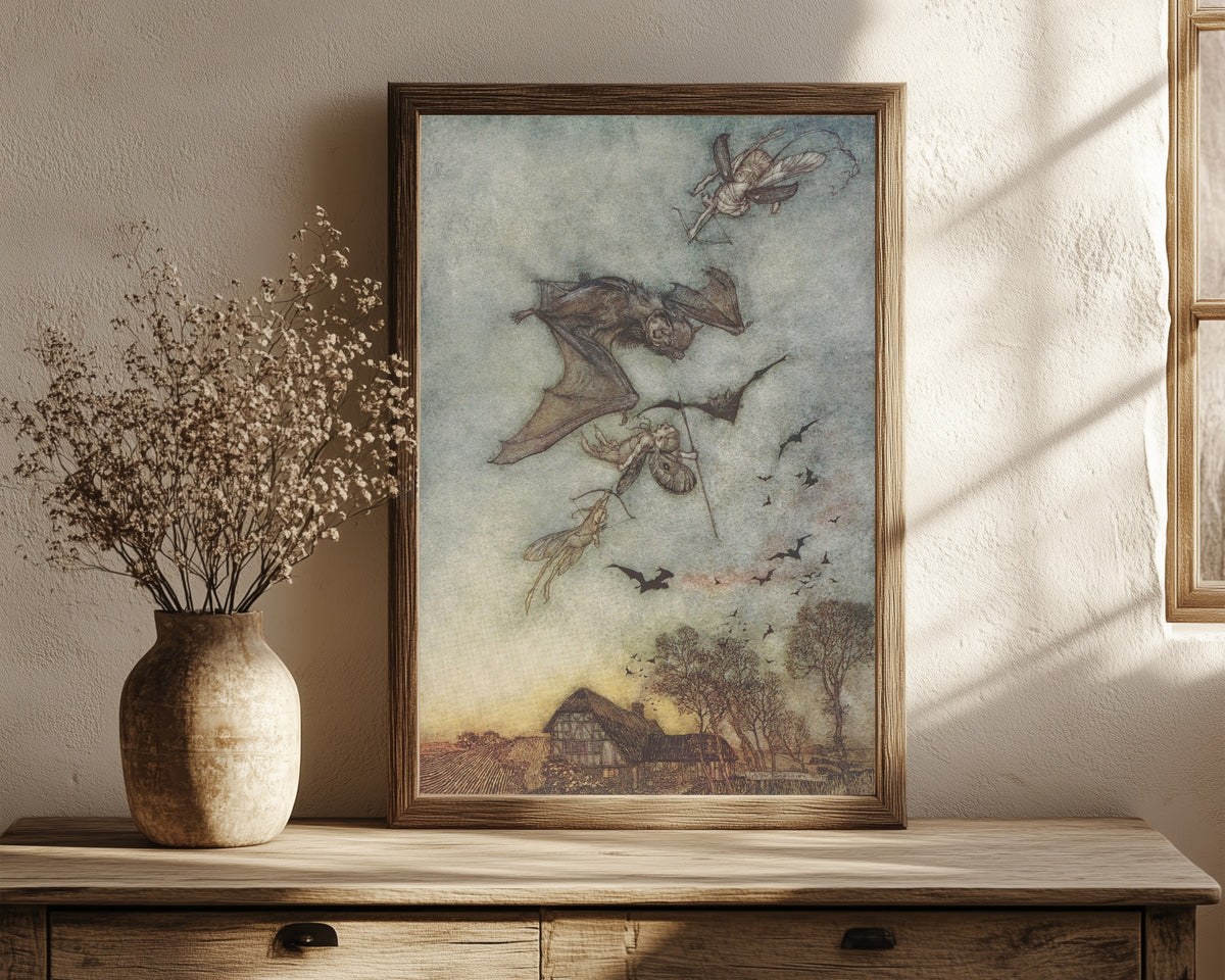 Framed art print of Some War with Rere-Mice for Their Leathern Wings by Arthur Rackham, in a dark wood frame leaning on a rustic console beside dried flowers