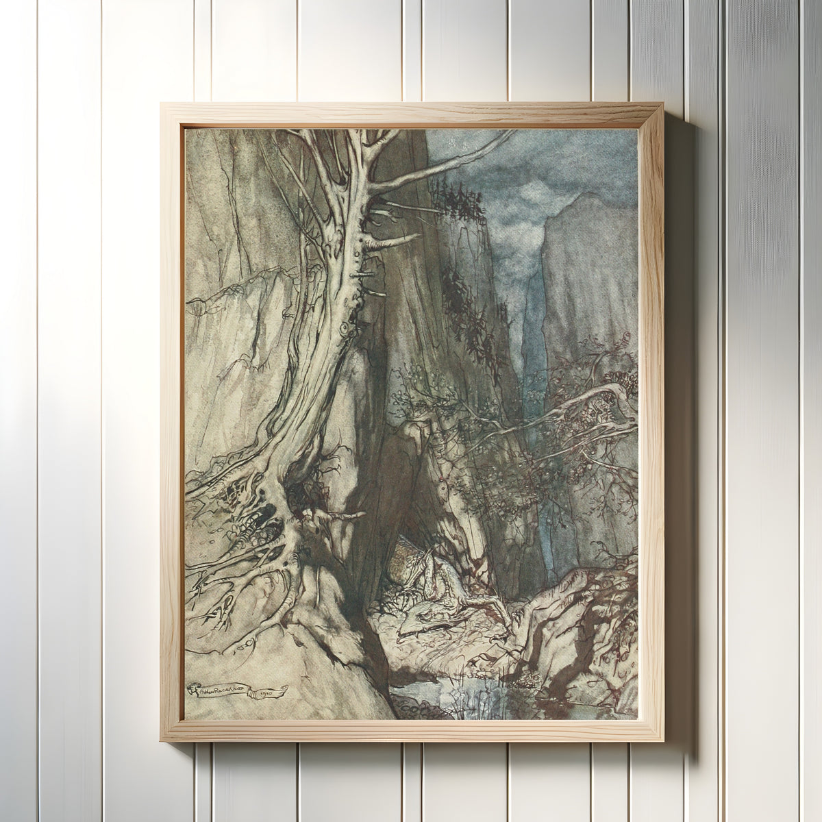 Framed art print of There as a Dread Dragon He Sojourns by Arthur Rackham, in a light wood frame on a white panelled wall