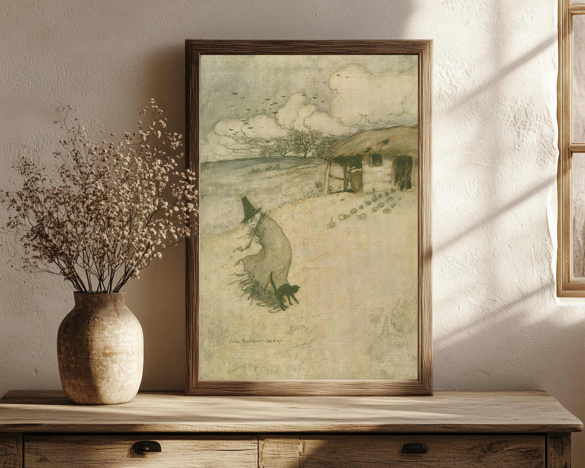 Framed art print of There’s an Old Woman Dwells upon Tappington Moor by Arthur Rackham, in a dark wood frame leaning on a rustic console beside dried flowers