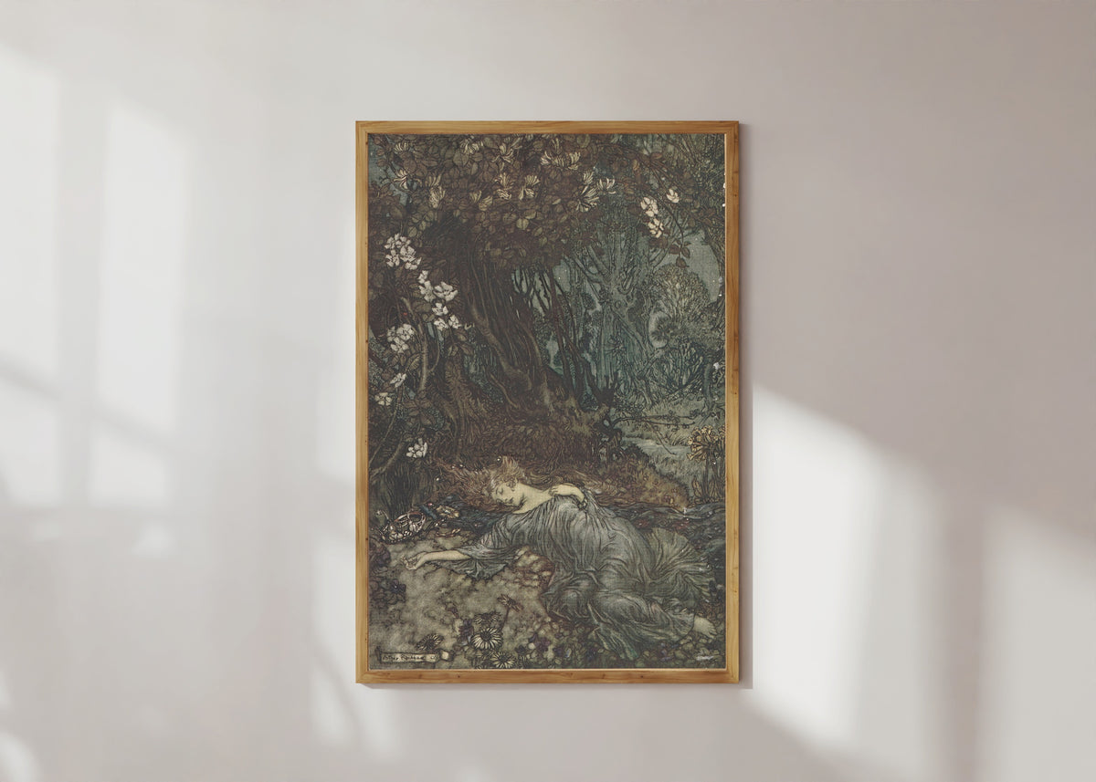 Framed art print of Titania Lying Asleep by Arthur Rackham, in a light wood frame on a sunlit white wall