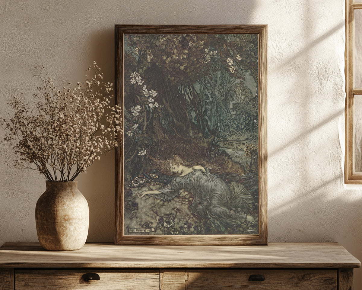 Framed art print of Titania Lying Asleep by Arthur Rackham, in a dark wood frame leaning on a rustic console beside dried flowers