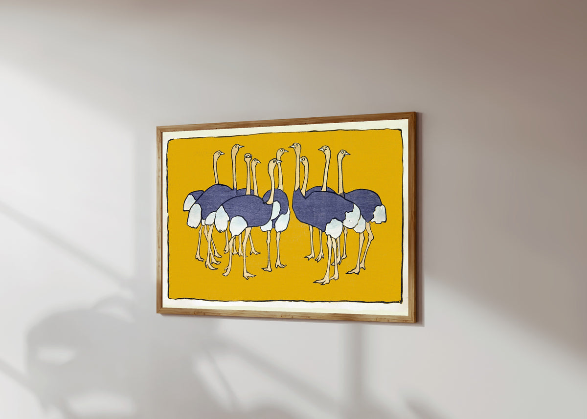 Framed art print of Ostriches by Asai Chū, in a light wood frame on a sunlit white wall, seen at a slight angle