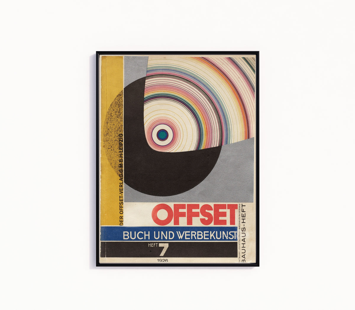 Framed art print of Bauhaus Offset Magazine Cover by Joost Schmidt, in a slim black frame on a plain white wall