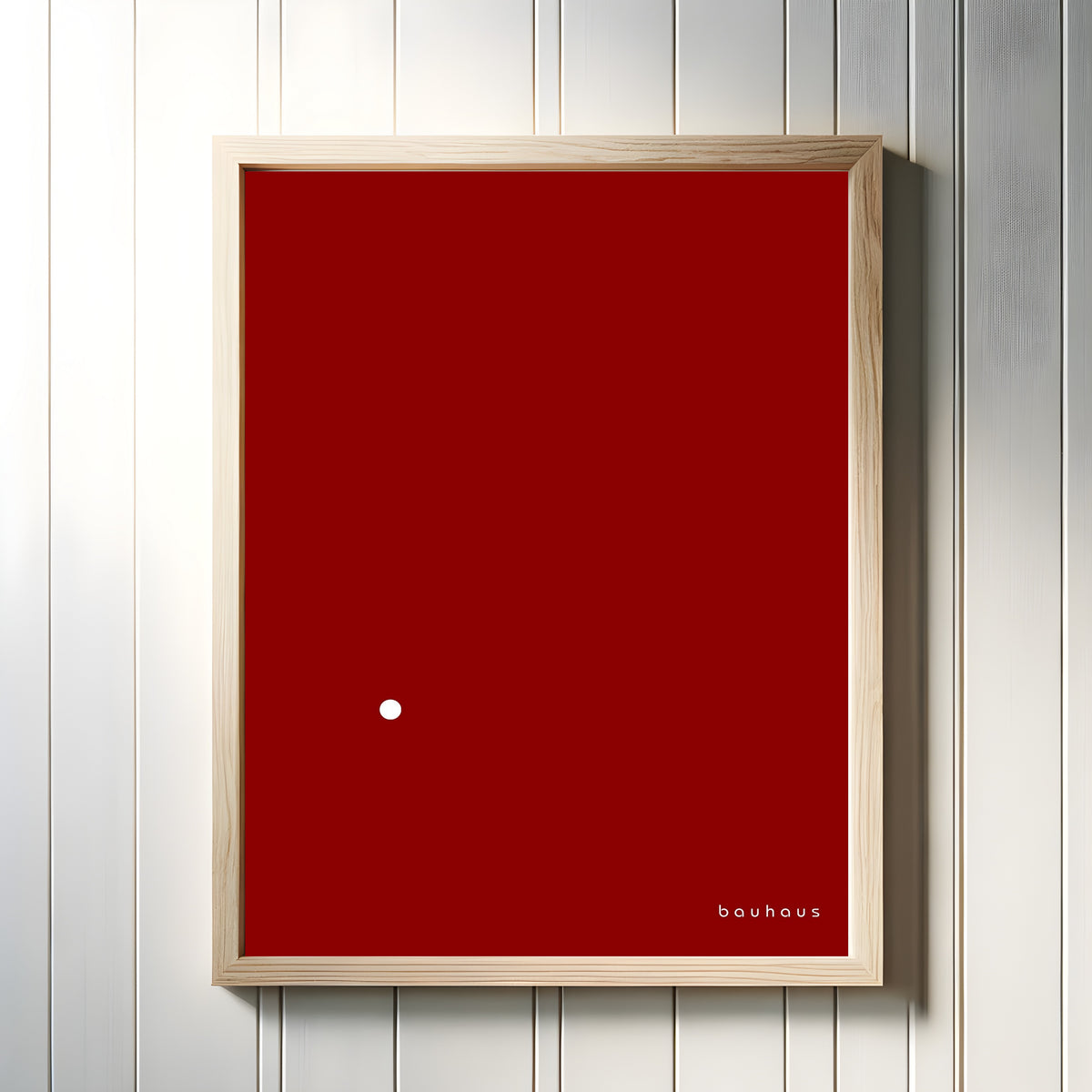 Framed art print of Bauhaus Der Punkt (The Dot) by Bauhaus, in a light wood frame on a white panelled wall