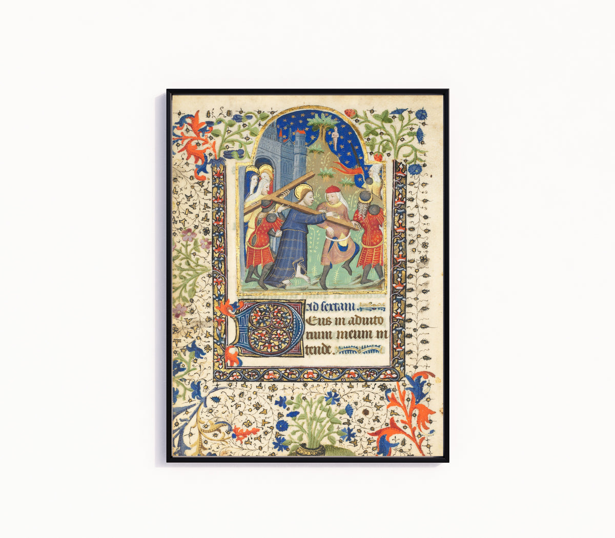 Framed art print of Book of Hours: Christ Carrying the Cross, in a slim black frame on a plain white wall