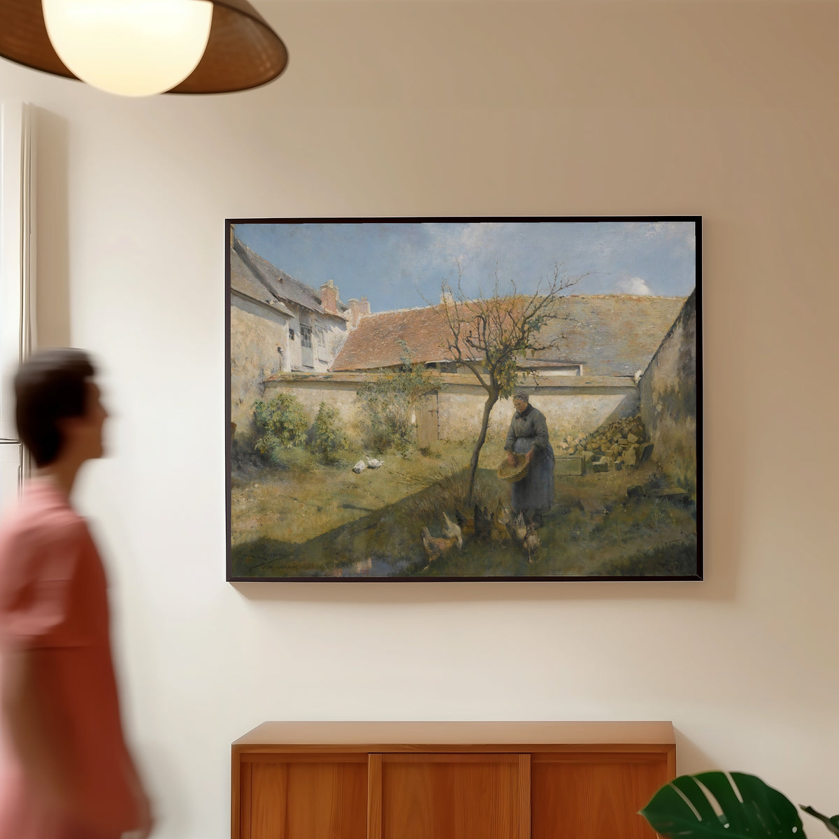 Framed art print of À la campagne by Carl Larsson, in a slim black frame on a warm wall in a sunlit room
