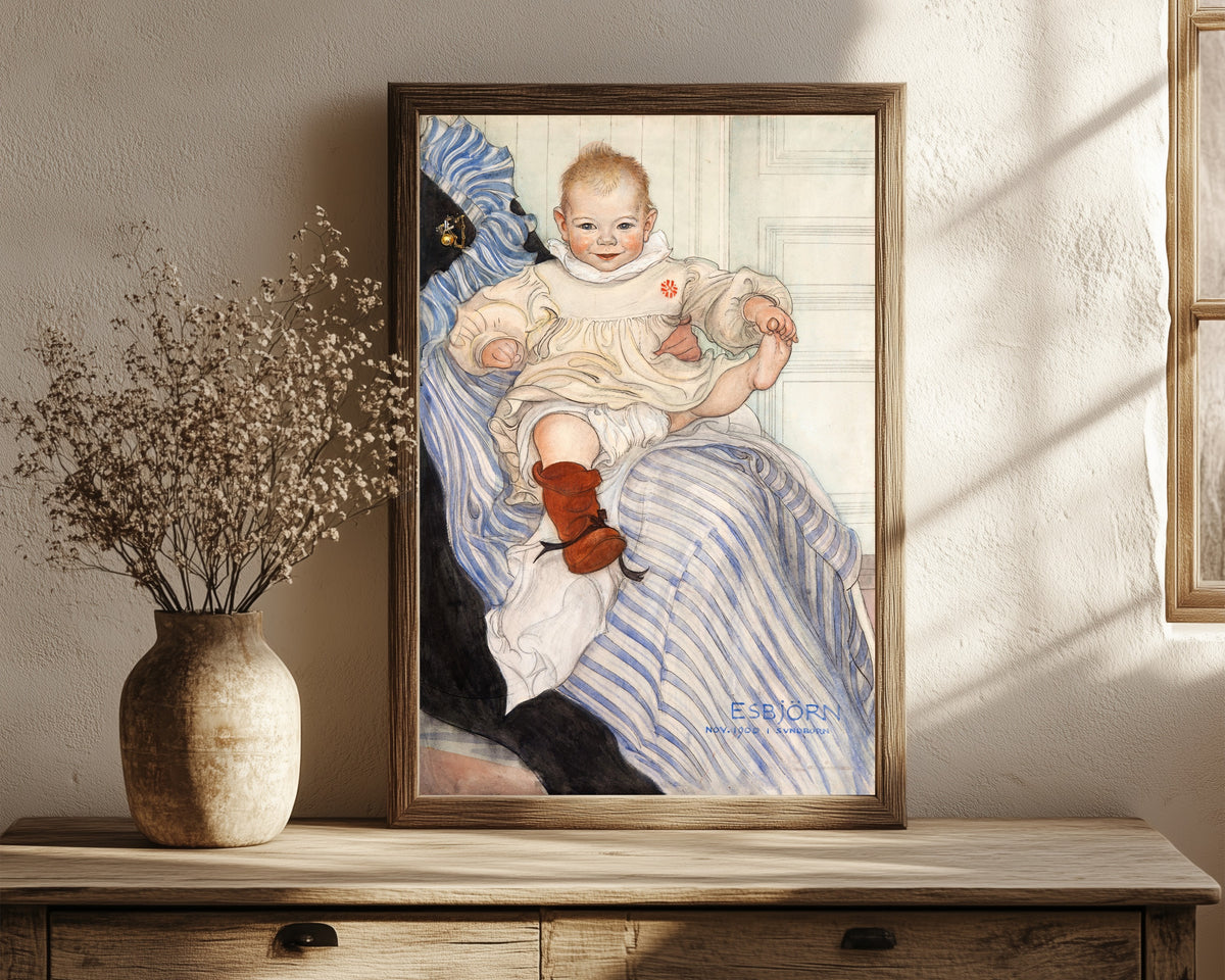 Framed art print of Esbjörn by Carl Larsson, in a dark wood frame leaning on a rustic console beside dried flowers