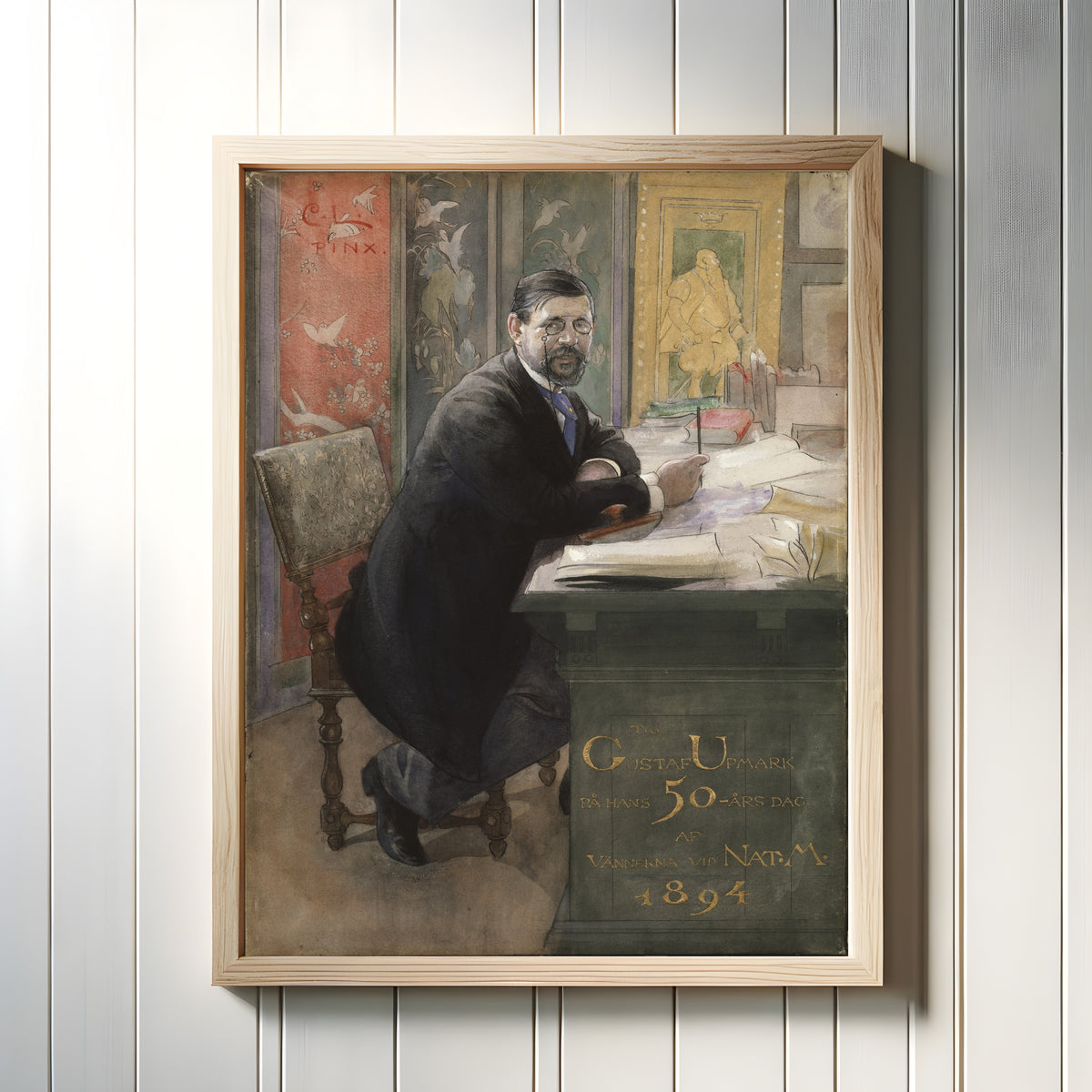 Framed art print of Gustaf Upmark, director of the Nationalmuseum by Carl Larsson, in a light wood frame on a white panelled wall