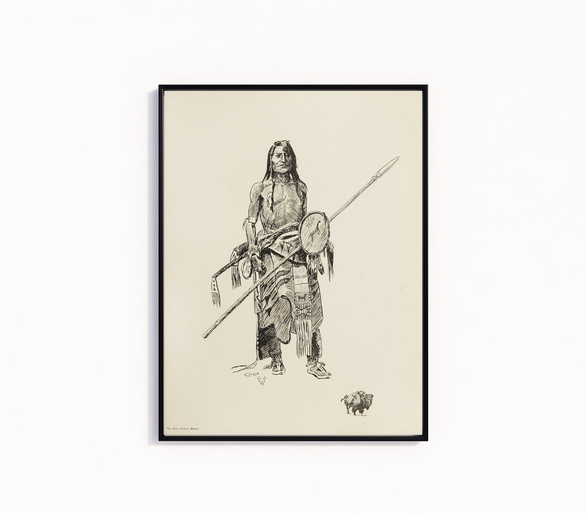 Framed art print of The Sioux Buffalo Hunter by Charles M. Russell, in a slim black frame on a plain white wall