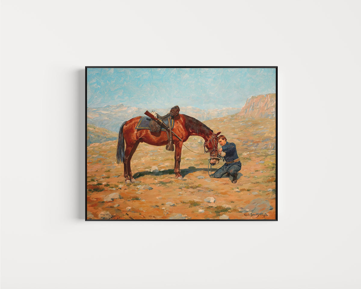 Framed art print of The Last Drop by Charles Schreyvogel, in a slim black frame on a plain white wall