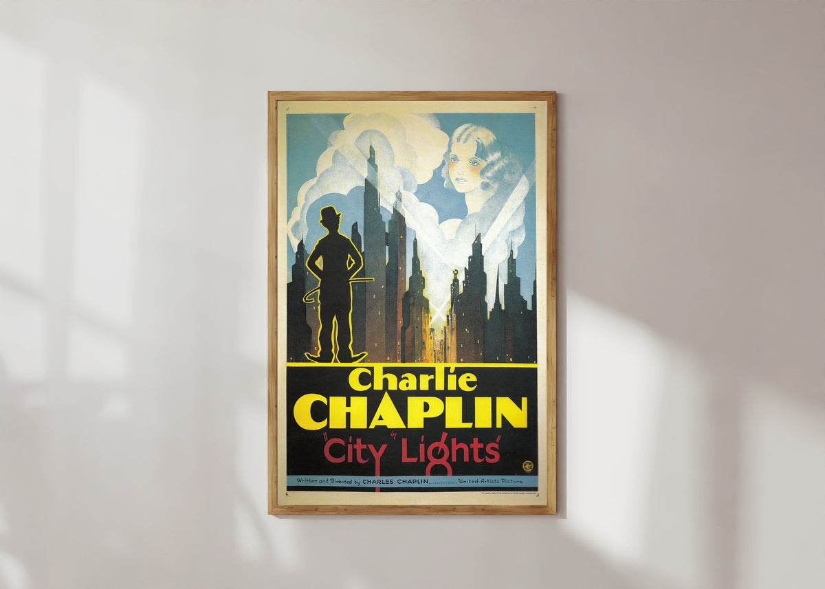 Framed art print of City Lights, in a light wood frame on a sunlit white wall