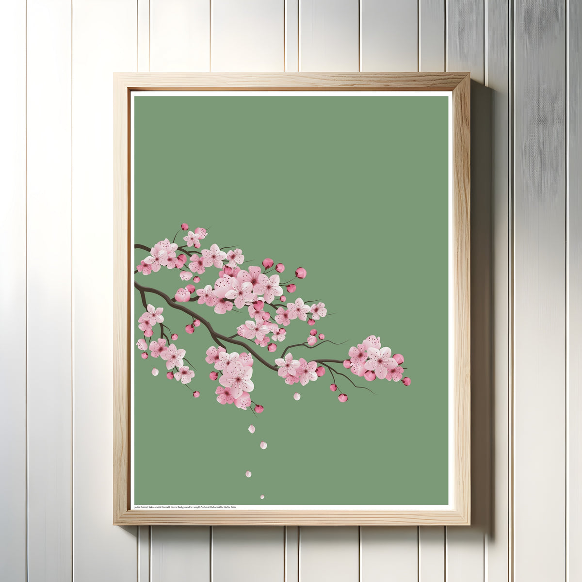 Framed art print of Cherry Blossoms with Emerald Green Background by Original, in a light wood frame on a white panelled wall