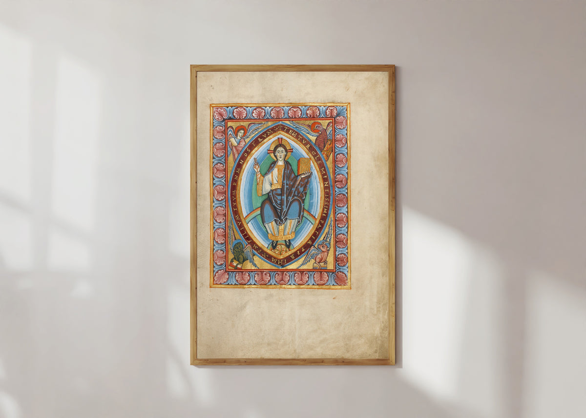 Framed art print of Christ in Majesty, in a light wood frame on a sunlit white wall