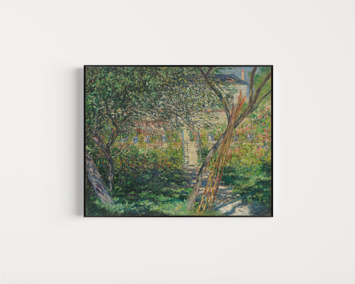 Framed art print of Garden at Vétheuil by Claude Monet, in a slim black frame on a plain white wall