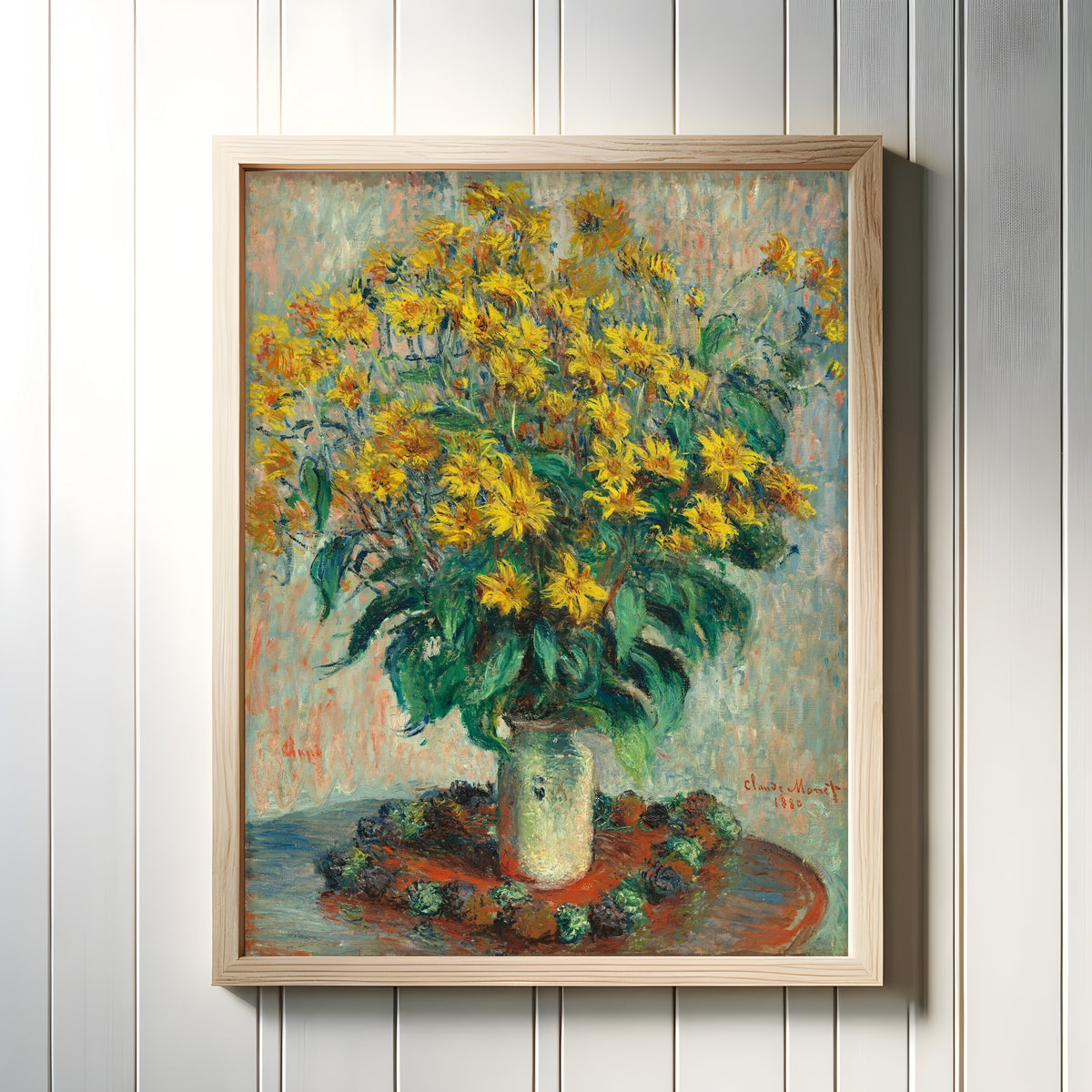 Framed art print of Jerusalem Artichoke Flowers by Claude Monet, in a light wood frame on a white panelled wall