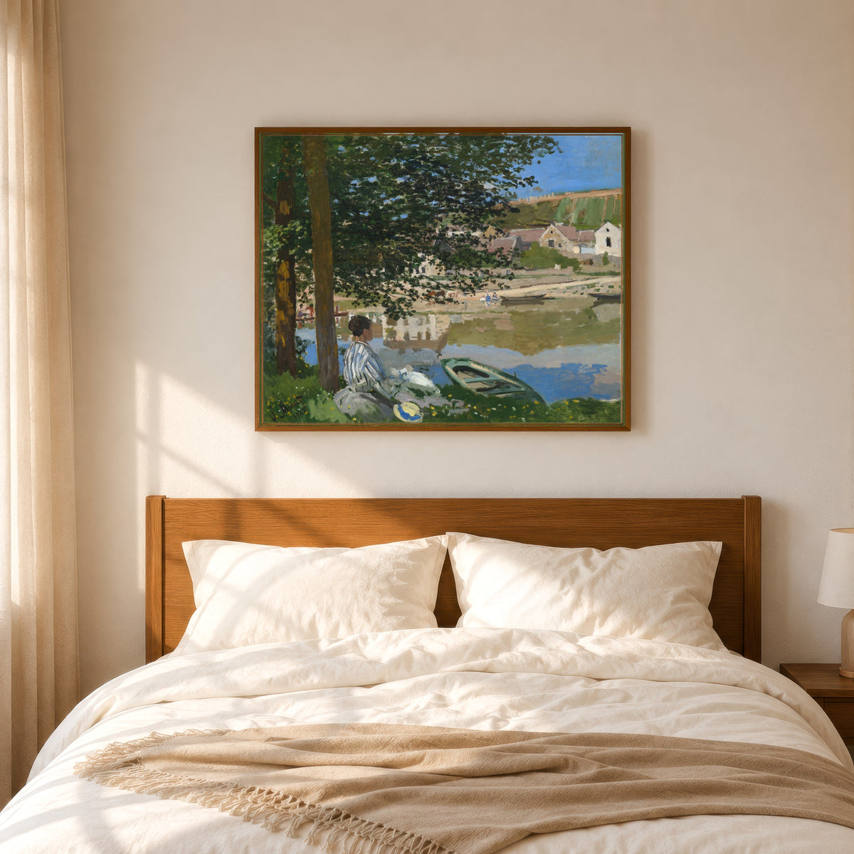 Framed art print of On the Bank of the Seine, Bennecourt by Claude Monet, in a slim wood frame above a bed in a sunlit bedroom