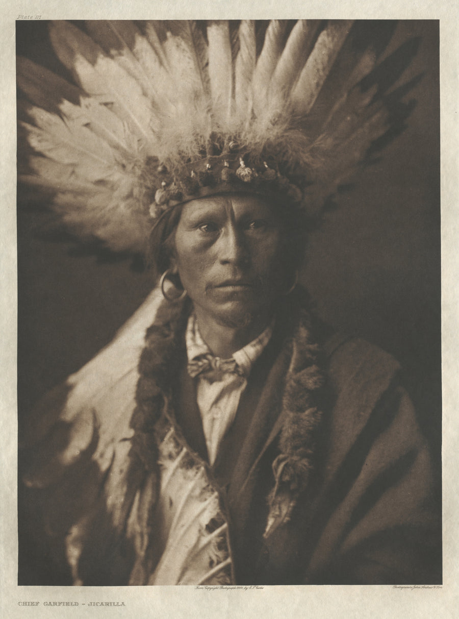Edward S. Curtis — Chief Garfield, Jicarilla | Vintage Photograph Print shown to scale on a wall above a sofa