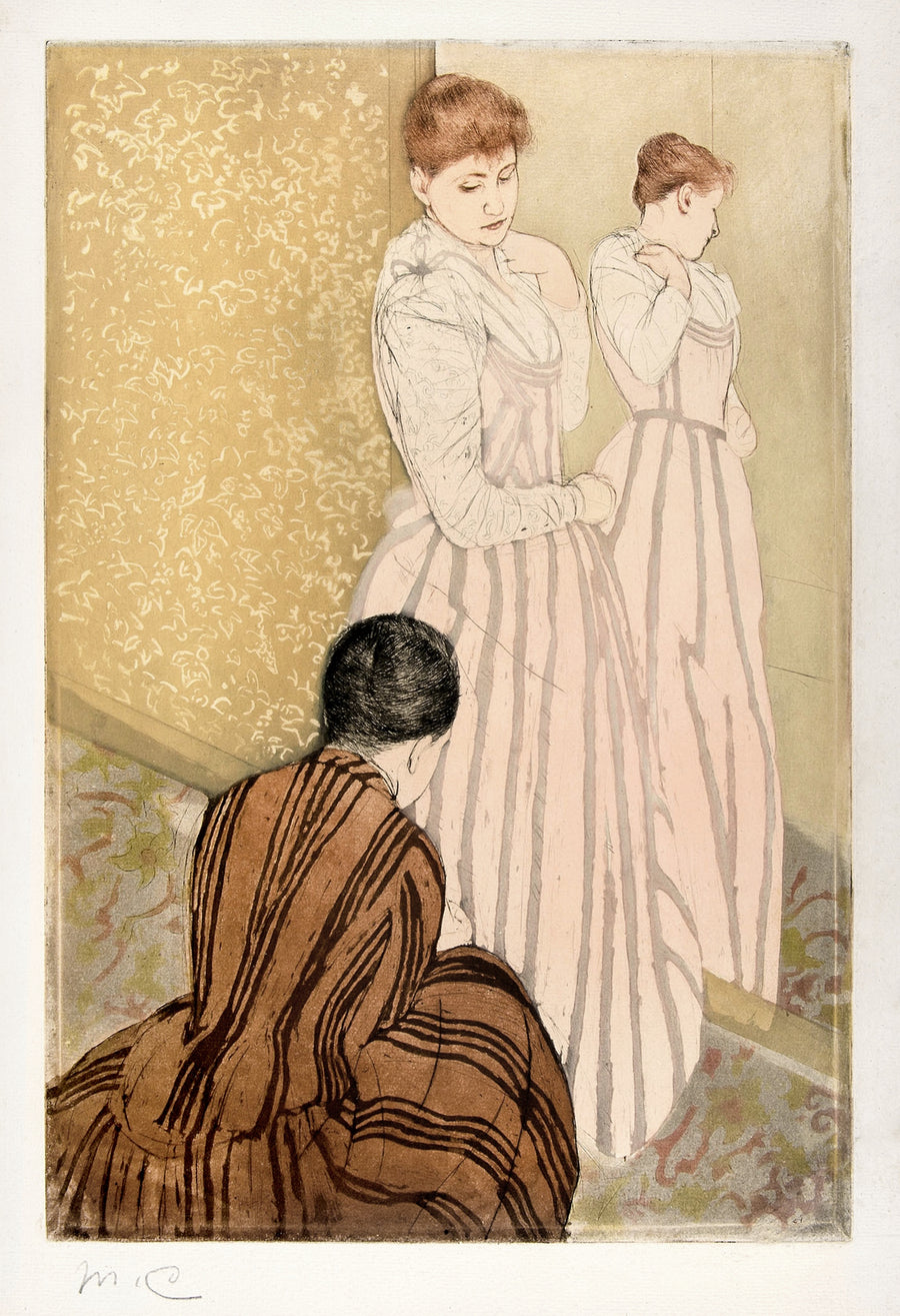 Mary Cassatt — The Fitting | Fine Art Print shown to scale on a wall above a sofa