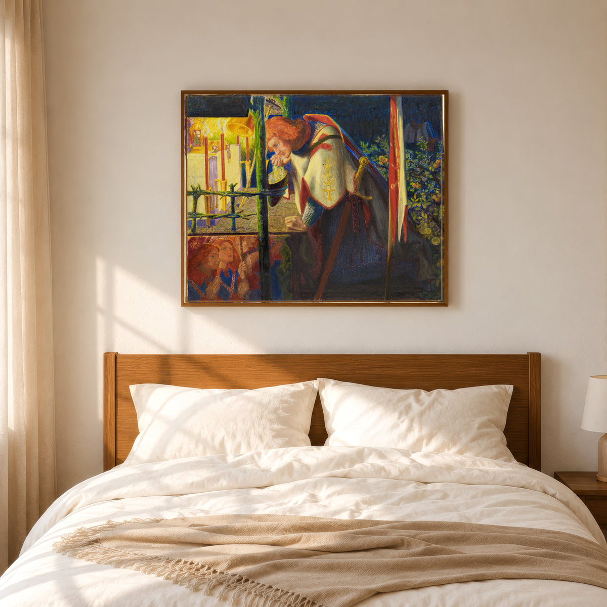 Framed art print of Sir Galahad at the Ruined Chapel by Dante Gabriel Rossetti, in a slim wood frame above a bed in a sunlit bedroom
