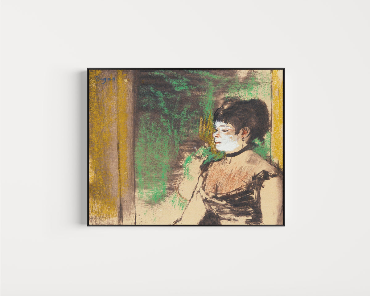 Framed art print of Chanteuse de café-concert by Edgar Degas, in a slim black frame on a plain white wall