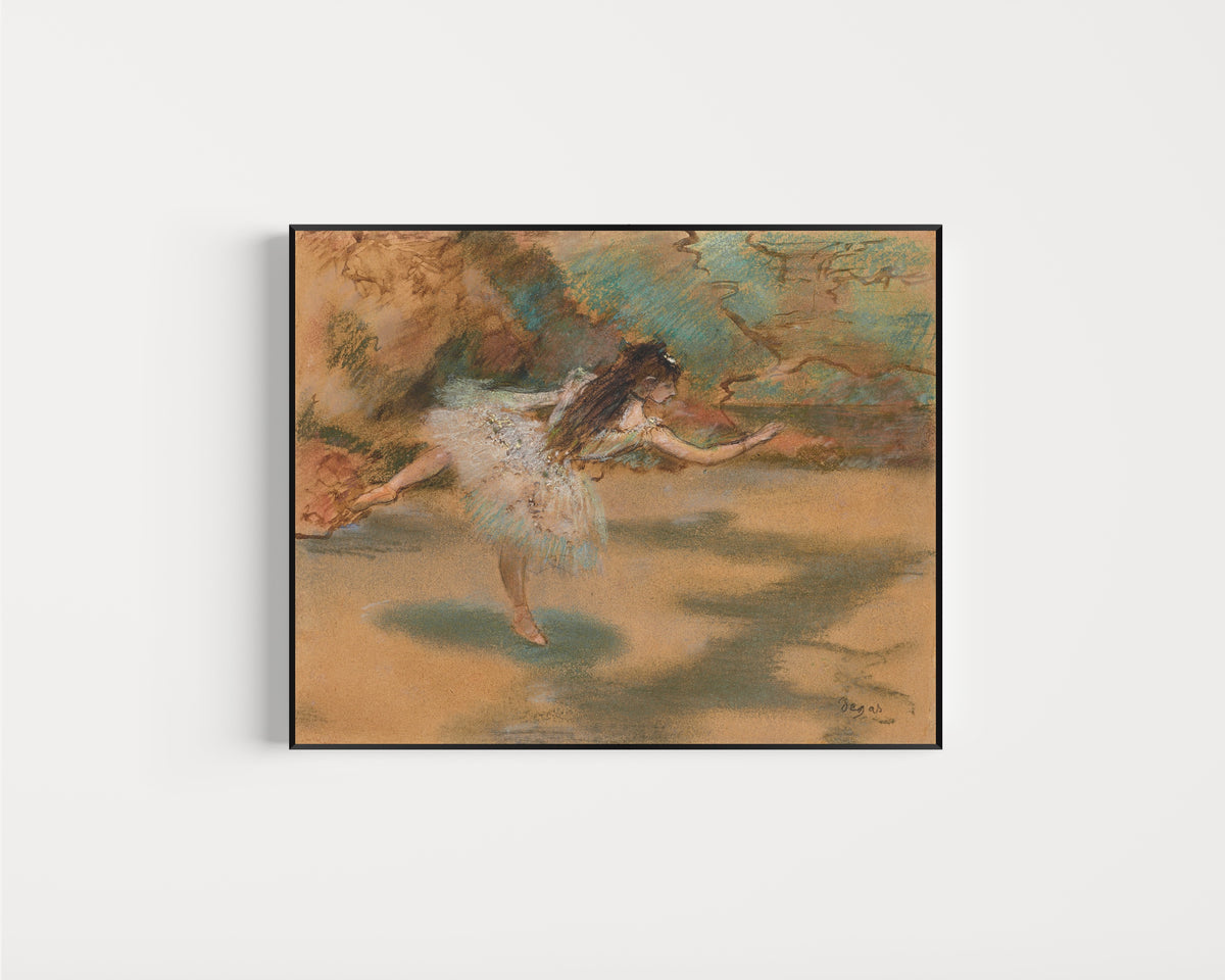 Framed art print of Dancer on Pointe by Edgar Degas, in a slim black frame on a plain white wall